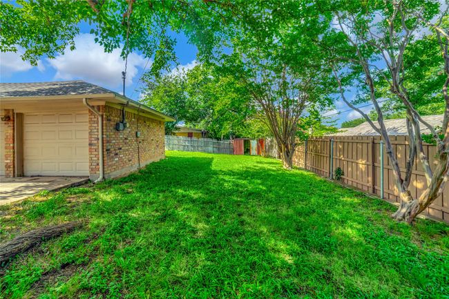 View of yard featuring an attached garage | Image 33