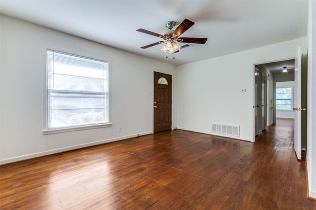 Empty room featuring dark wood-style floors and ceiling fan | Image 4