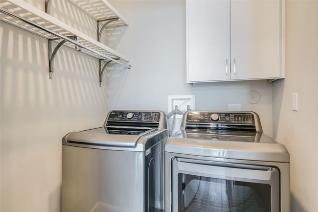 Shelves were installed to provide additional storage in your laundry room where a washer and dryer conveys with your purchase! | Image 24