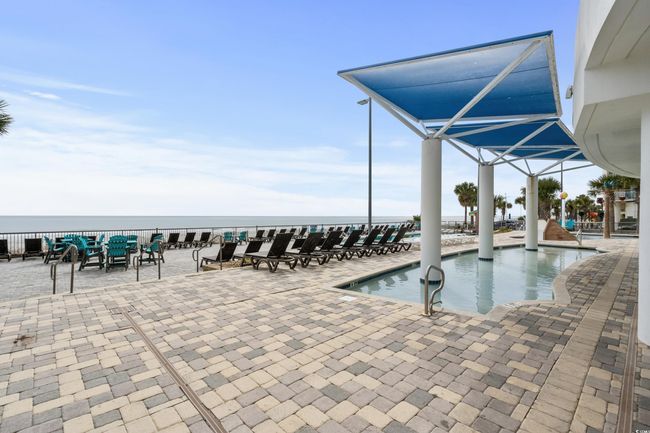 View of pool with a water view and a patio area | Image 35