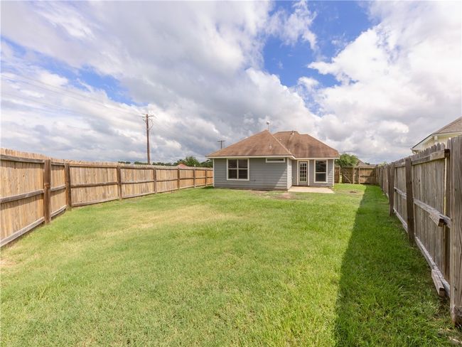 Rear view of house featuring a patio | Image 16