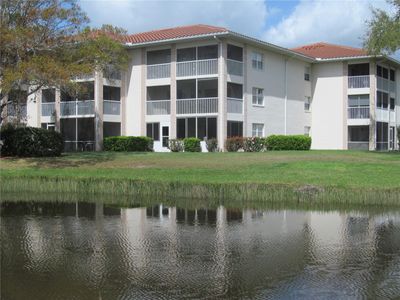 view of condo from across the pond | Image 1