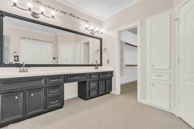 Double sinks and entry to walk in closet. | Image 18