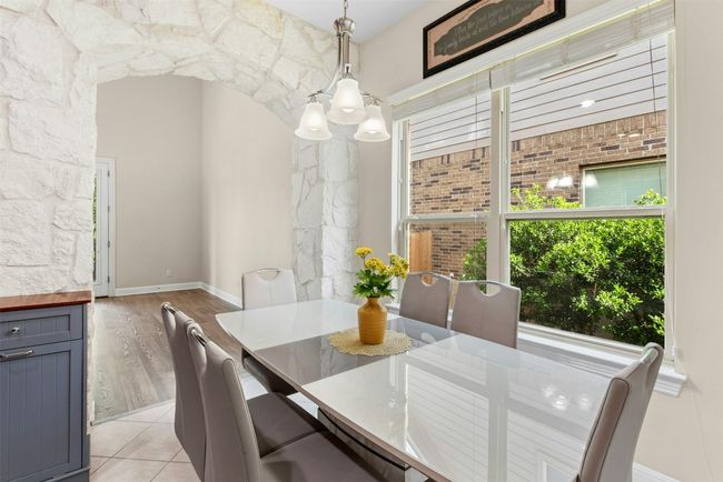 Light and bright dining off the kitchen. | Image 7