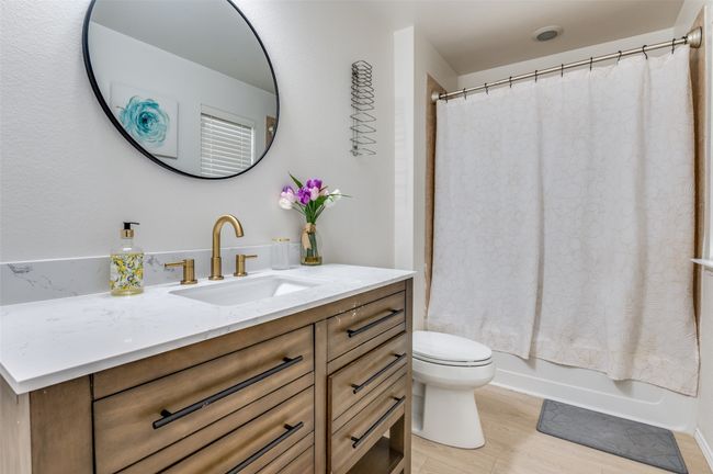 Full bath with vanity, wood finished floors, and shower / bath combination on the 2nd level. | Image 9