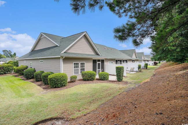 View of home's exterior featuring roof with shingles | Image 28
