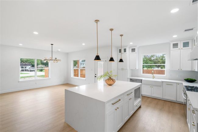 The dreamy kitchen opens up to dining room, easy access to the back yard entertainment! | Image 14