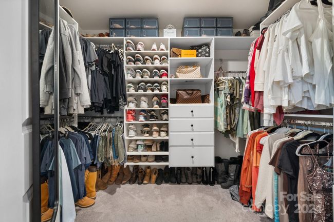 Her closet is upgraded with loads of solid shelving for shoes and clothes! | Image 33