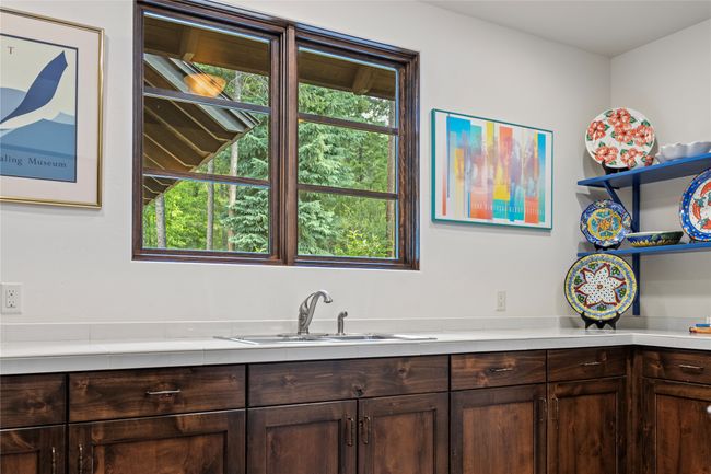 Sink in laundry room and ample storage. | Image 45