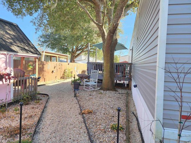 View of yard with a wooden deck | Image 26