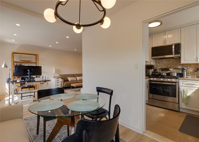 Dining space with recessed lighting, crown molding, and baseboards | Image 10
