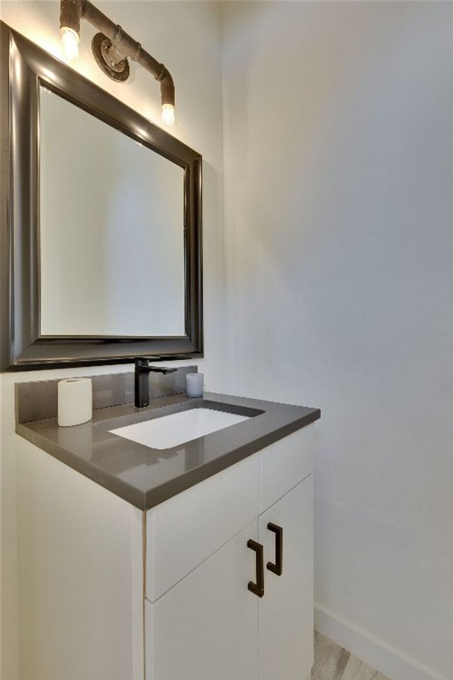 Bathroom featuring vanity and baseboards | Image 9