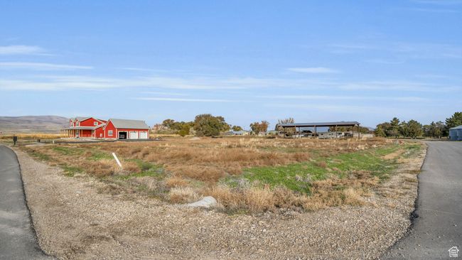 View of street with a rural view and a barn | Image 8
