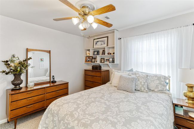 Abundant natural light pours into Bedroom #2 through two large windows, creating a bright & welcoming atmosphere, making the room feel bright and airy. | Image 15