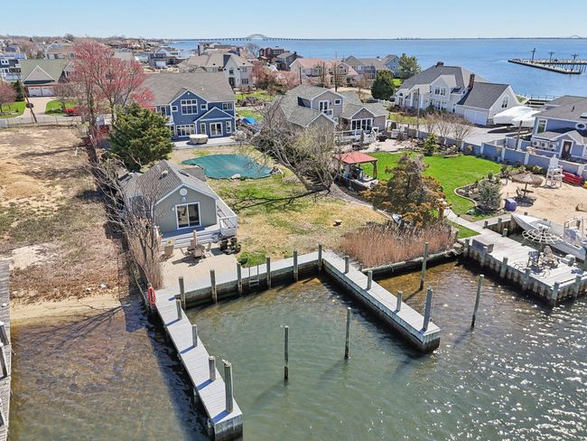 Dock area featuring a water view and a residential view | Image 48