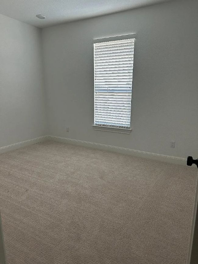 Empty room featuring carpet floors and baseboards | Image 8