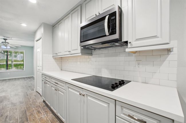 Bright, clean, and thoughtfully laid out, this kitchen with new stainless steel appliances is as beautiful as it is functional—ready to support your daily rhythm. | Image 10