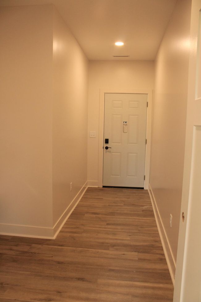 Entrance from garage, mudroom and laundry combination | Image 19