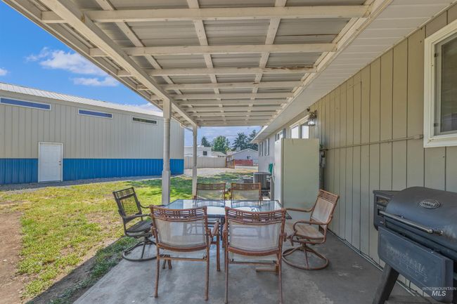 View of patio / terrace with a grill and outdoor dining space | Image 25