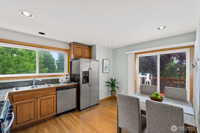 Your kitchen has stainless appliances and room for a table. | Image 9