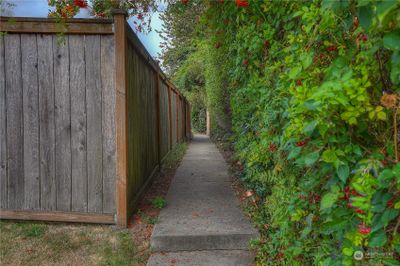 When you park on N 8th, there is a paved path that leads to the gated entry into the front yard of the home. | Image 3