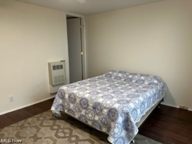 View of hardwood floored bedroom | Image 10