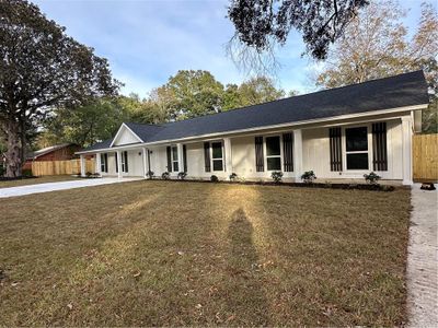 fabulous brick ranch offers over 3000 square feet of heated and cooled living area with four bedrooms and three full baths! | Image 1