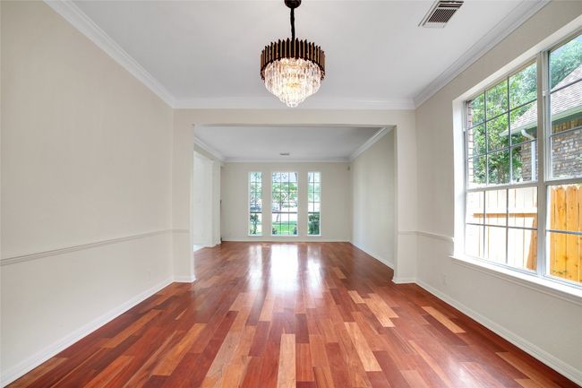 Spare room with great natural light, a chandelier | Image 12