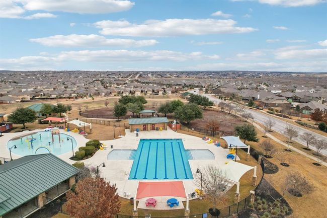 Community pool with a patio area and a residential view | Image 36