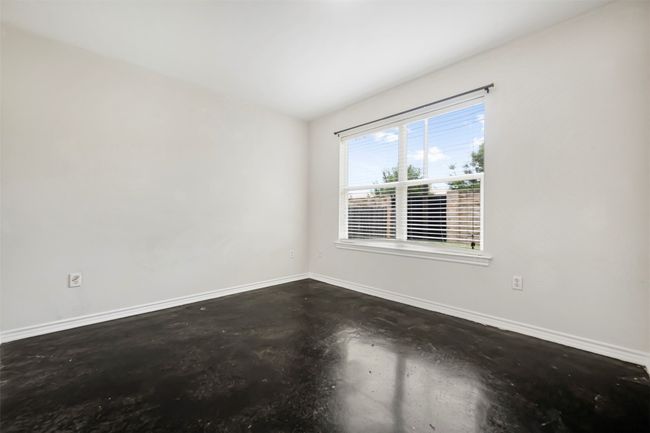 Spare room with finished concrete flooring and baseboards | Image 24