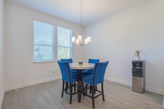 A closer look at the breakfast area and its overhead light fixture. | Image 16