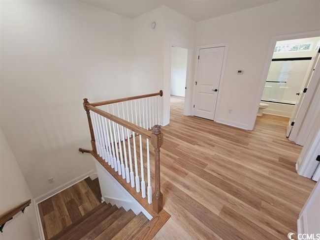 Stairs featuring baseboards and wood finished floors | Image 28
