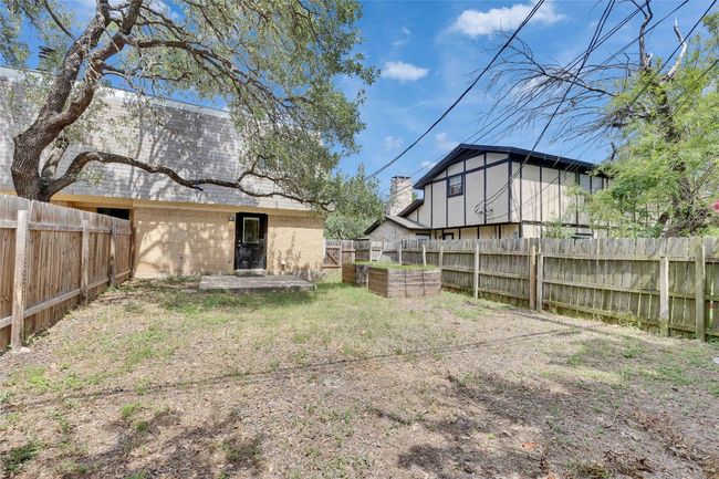 Spacious private backyard with lots of live oak trees. | Image 13