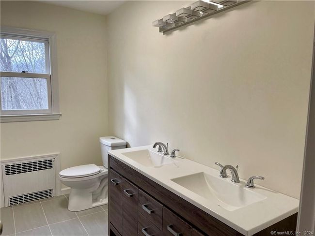 Remodeled Hall Bathroom with twin sink vanity. | Image 8