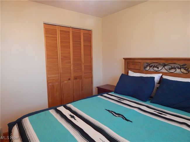 Bedroom 3 featuring a double closet and hardwood floors. | Image 20