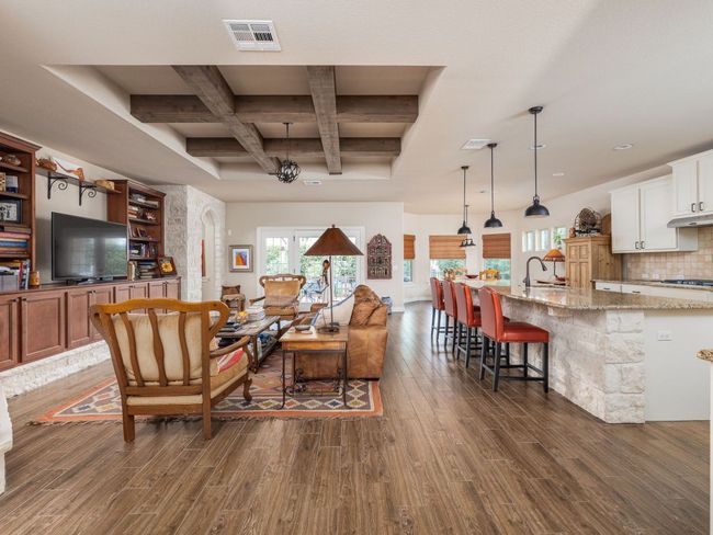 Living room opens to kitchen with 12.5' kitchen island | Image 5