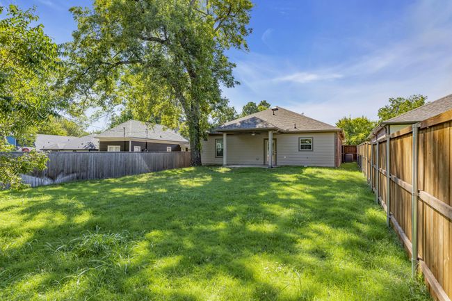 View of yard featuring a fenced backyard | Image 25
