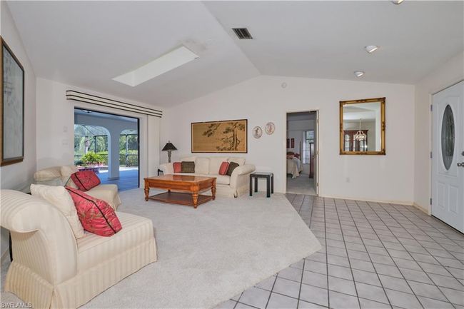 Formal Living Room with Pocket Sliding Glass Doors to the Lanai/Pool. | Image 11