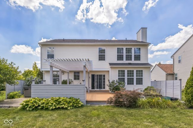 back of property featuring a pergola and a chimney | Image 31