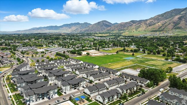 Aerial view of property and surrounding area featuring mountains and nearby suburban area | Image 31
