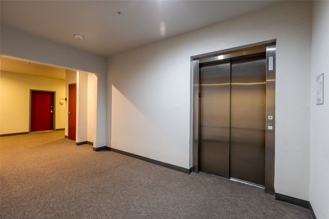 Hallway featuring elevator and carpet floors | Image 6