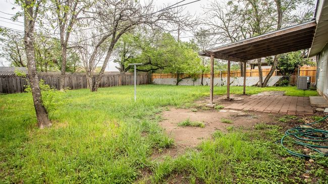 View of yard with privacy fence and patio area | Image 21