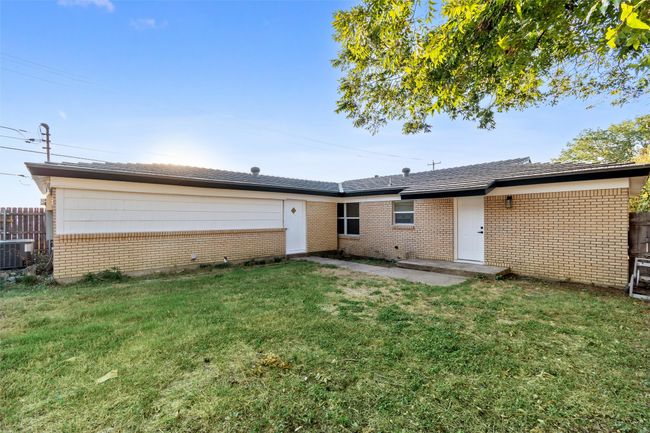 Back of property with central AC and a lawn | Image 34
