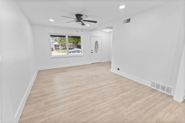 Spare room with ceiling fan, recessed lighting, light wood finished floors, and baseboards | Image 10
