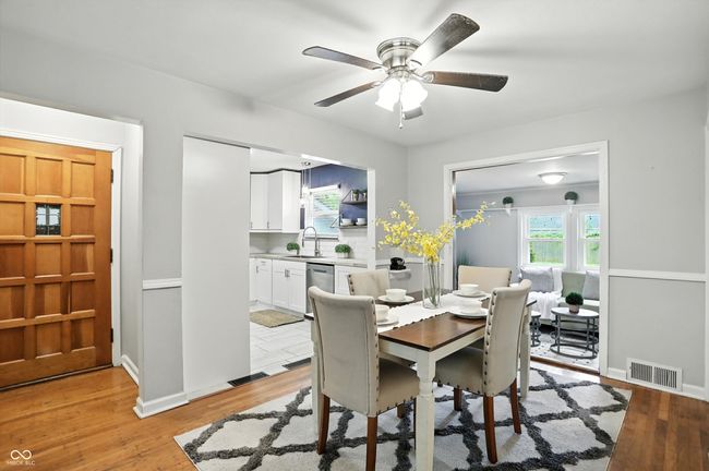 dining space with a ceiling fan and light wood-style floors | Image 10