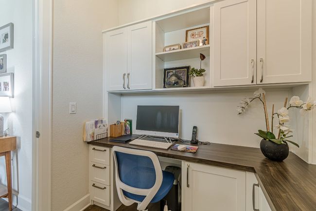 Home office featuring built in desk and baseboards | Image 7