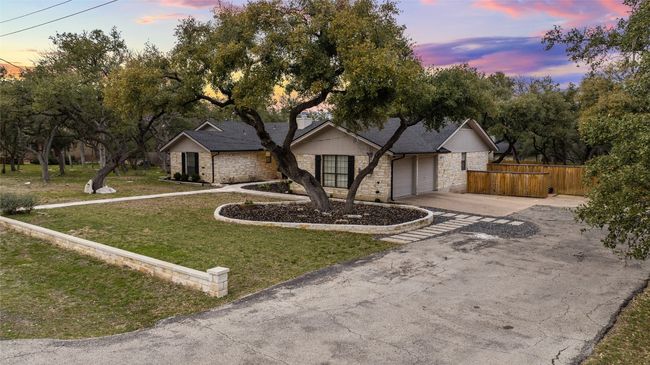 Ample driveway parking plus 2-car attached garage. | Image 36