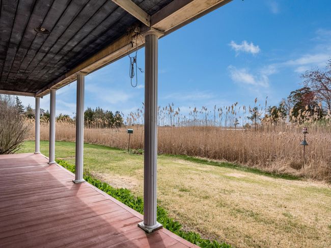 The side view of the wrap-around porch. | Image 20