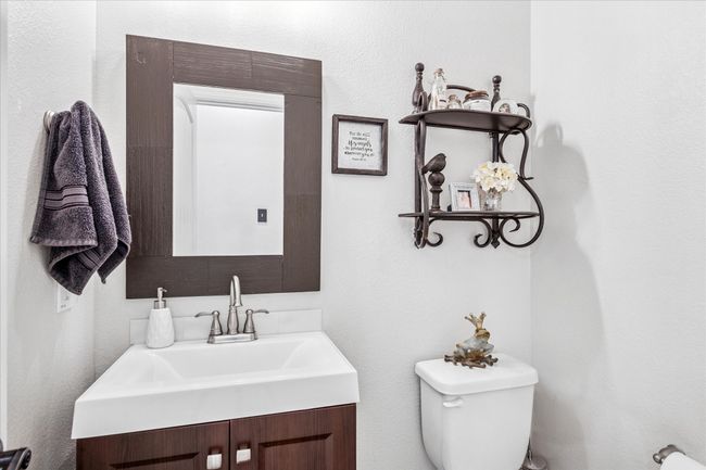Half bath featuring vanity and toilet | Image 18
