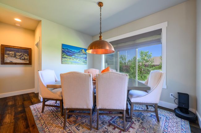 Dining space with wood finished floors | Image 14